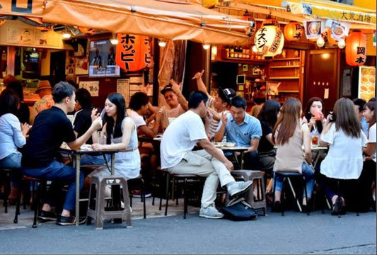 Ordering food in a Japanese restaurant by pointing at the menu